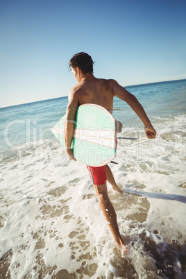 Man running on beach alone