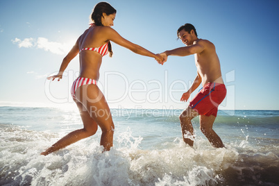 Couple playing in water