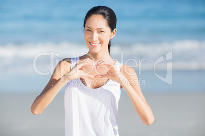 Woman making a heart shape