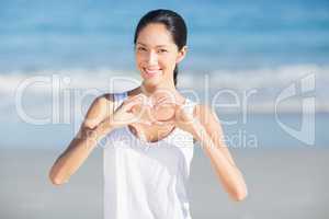 Woman making a heart shape