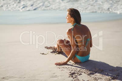 Woman sitting on beach