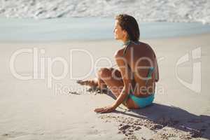 Woman sitting on beach