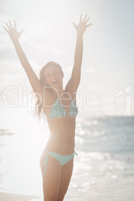 Excited woman on beach