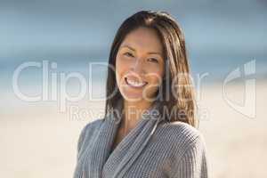 Happy woman standing on beach