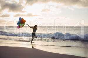 Woman running with the balloon