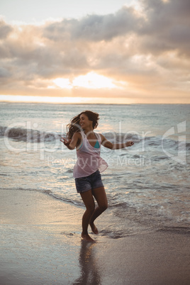 Beautiful woman having fun on the beach