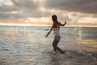 Beautiful woman having fun on the beach