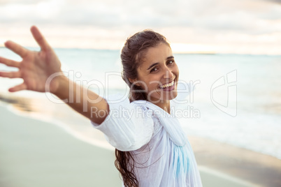 Portrait of woman stretching out her arms