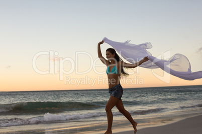 Woman running with a scarf