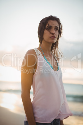Beautiful woman standing on the beach
