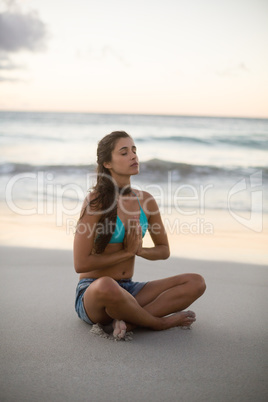 Young woman performing yoga