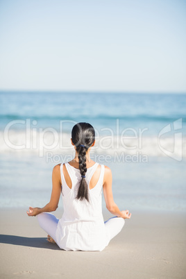 Woman performing yoga Woman performing yoga