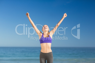 Beautiful young woman smiling while exercising