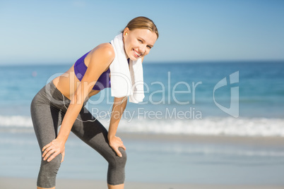Beautiful woman taking break after exercising