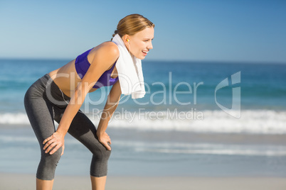 Beautiful woman taking break after exercising