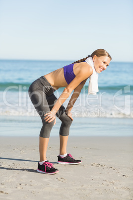 Beautiful woman taking break after exercising