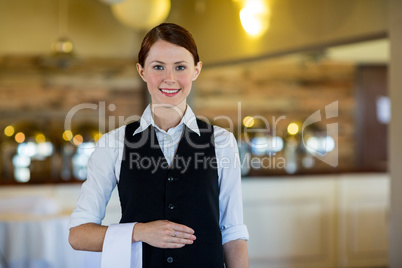 Waitress with napkin draped over her hand