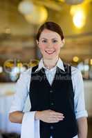 Waitress with napkin draped over her hand