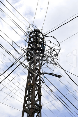 Many wires on an old electric pole