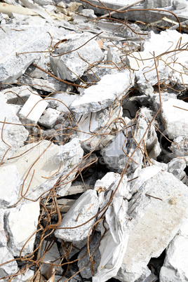 Pieces of Metal and Stone are Crumbling from Demolished Building