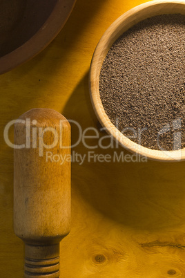 Poppy seeds in a wooden bowl