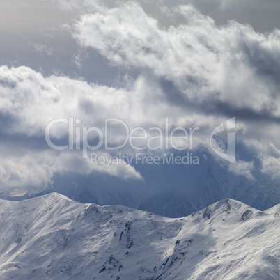 Evening mountains and sunlight cloudy sky