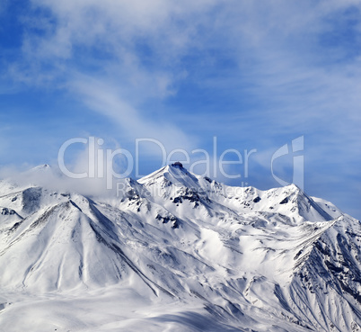 Winter snowy mountains in windy day