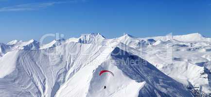 Panoramic view on sky gliding in high mountains