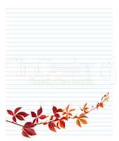 Red branch of grapes leaves on notebook paper