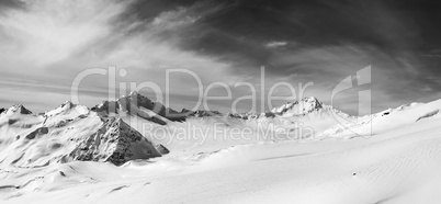 Black and white panoramic view on off-piste slope