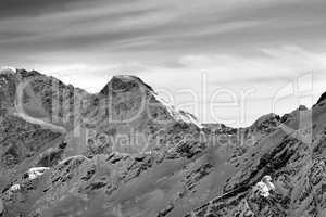 Black and white high mountains in winter evening