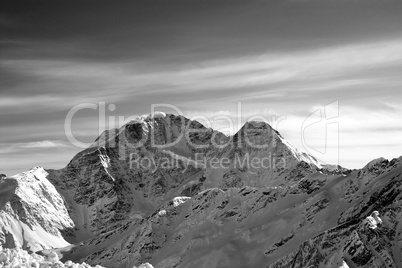 Black and white high mountains in evening