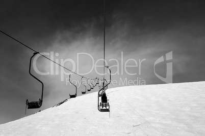 Black and white old chair-lift in ski resort