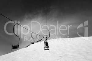 Black and white old chair-lift in ski resort