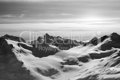 Black and white snowy mountains in evening