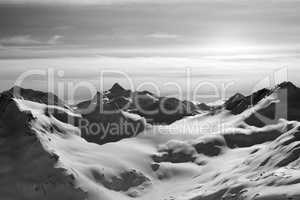 Black and white snowy mountains in evening