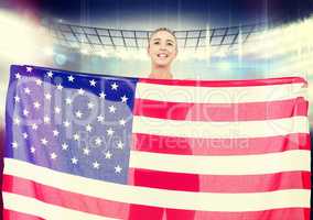 Composite image of female athlete holding american flag