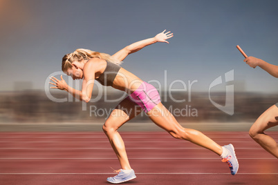 Composite image of sporty woman running on a white background