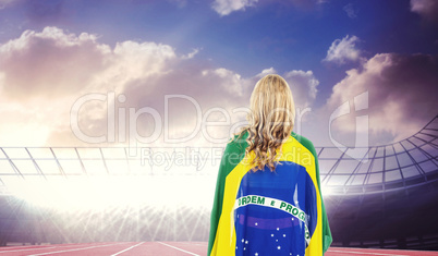 Athlete with brazilian flag wrapped around her body