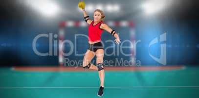 Composite image of female athlete with elbow pad throwing handba