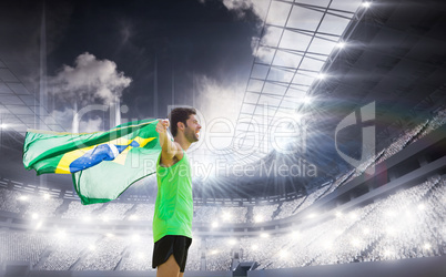 Composite image of profile view of brazilian sportsman is holdin