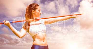 Composite image of front view of sportswoman is practising javel