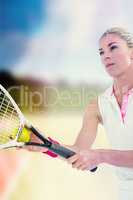 Concentrated athlete playing tennis