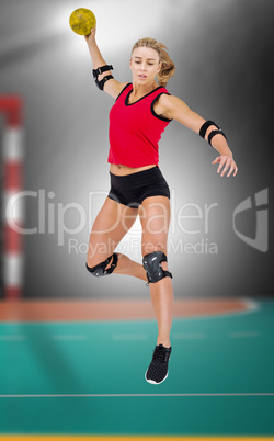 Composite image of female athlete with elbow pad throwing handba