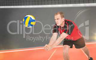 Composite image of sportsman posing while playing volleyball