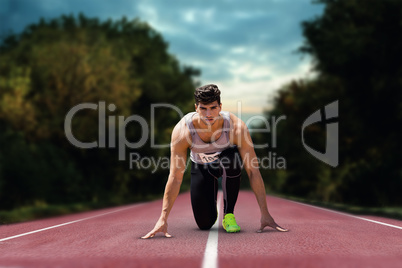 Composite image of sportsman waiting on the starting line
