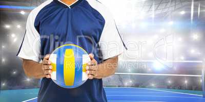 Composite image of mid-section of sportsman holding a volleyball