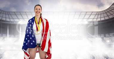 Composite image of athlete posing with american flag and gold me
