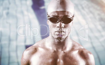 Composite image of serious swimmer posing with swimming equipmen