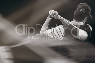 Composite image of man playing golf